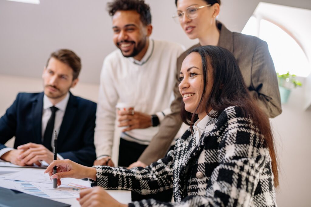 Marketing professionals collaborating during a team strategy meeting focused on communication and workplace culture